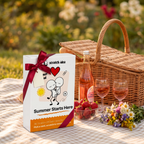 Summer Starts Here tied with a red ribbon as a picnic gift with strawberries and lemonade