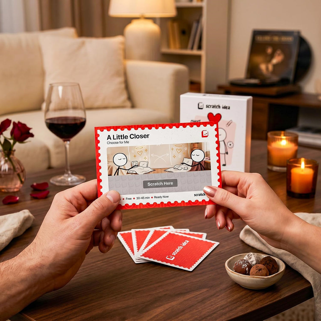 Reading an A Little Closer card with a glass of wine