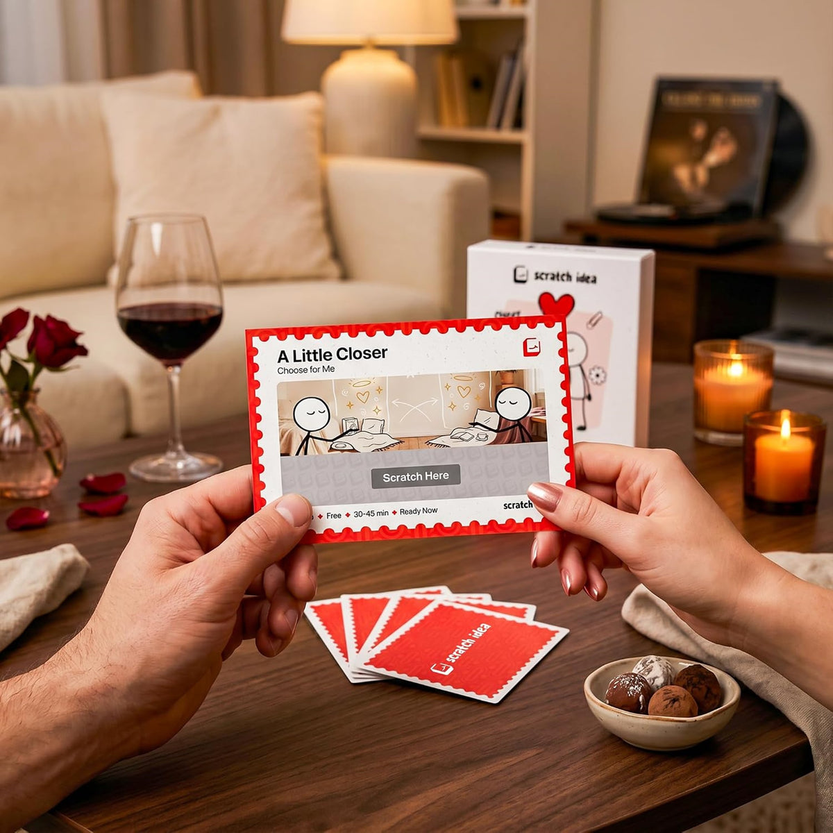 Reading an A Little Closer card with a glass of wine