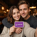 Smiling couple holding an Under $25 Tonight card